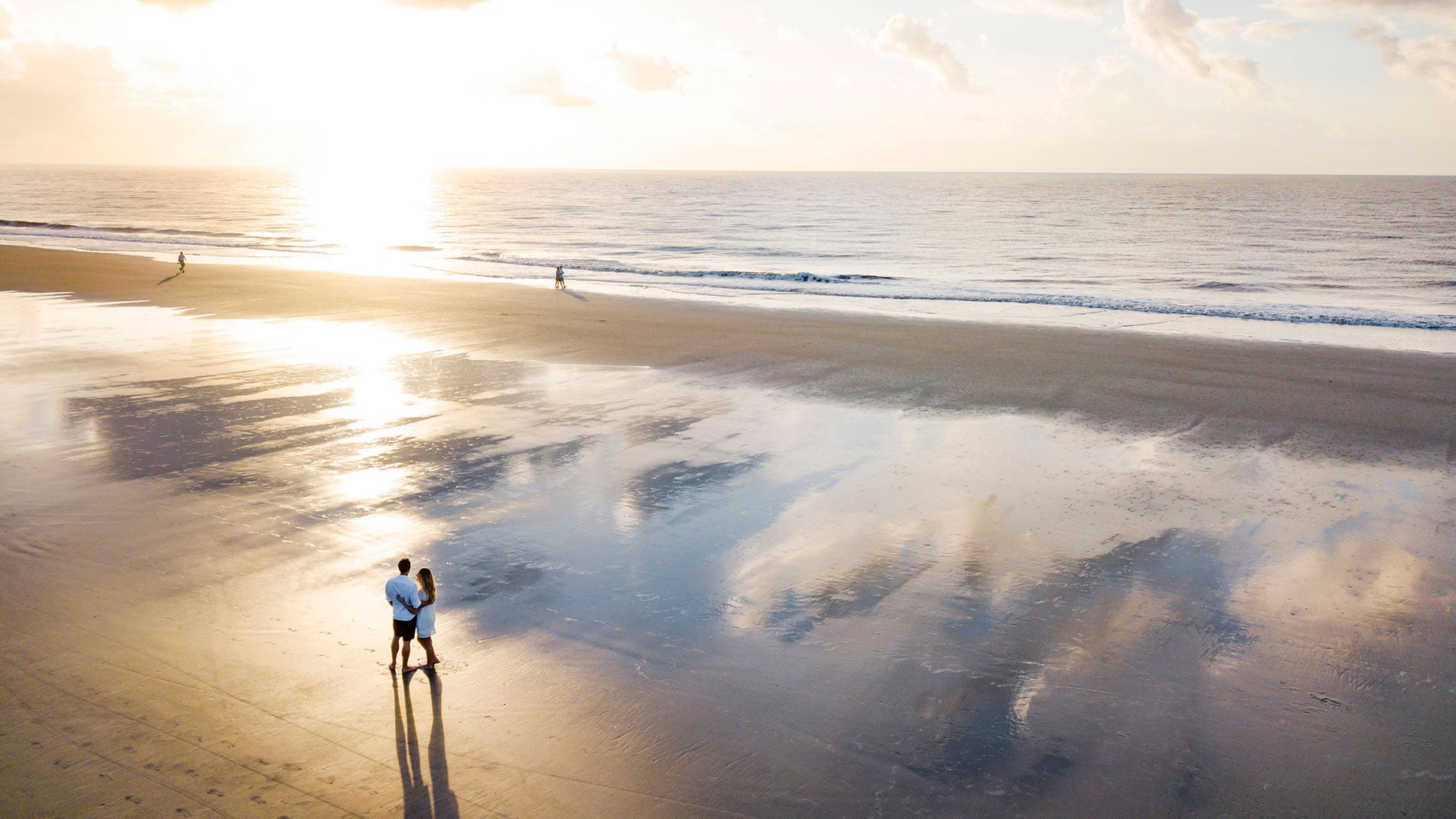A couple on a beach during sunset on Hilton Head Island, South Carolina.