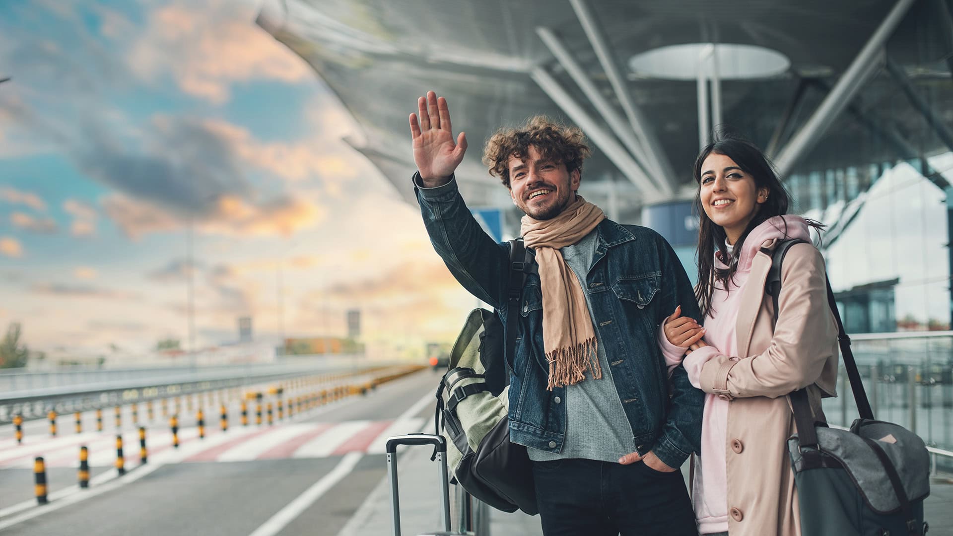 Couple at an airport hailing a ride